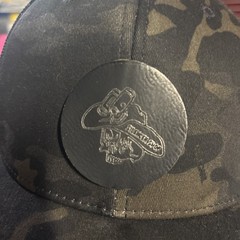 SPORT-TEK 2026 NRA Show Silencer Shop Dark Camo Trucker Hat OSFA