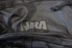 15″ X 11″ X 4″ BACKPACK ALL BLACK WITH “NRA” INSCRIPTION SEWN EMBROIDERED